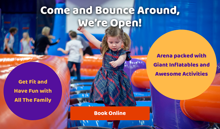 Child bouncing on the inflatable arena at Inflata Nation